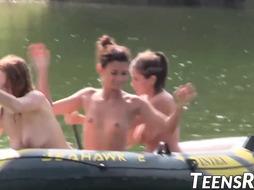 Gang of insane teenagers is having joy while swimming outdoor